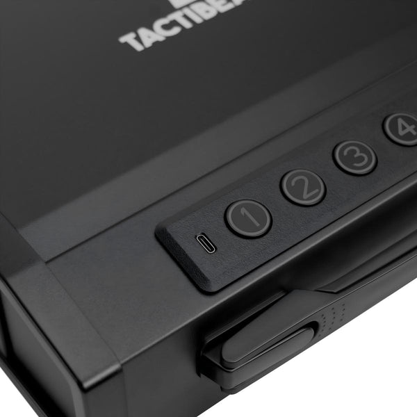 SHALE XL Biometric pistol safe with carry handle, close-up of the numbered access keys and the USB-C charging port