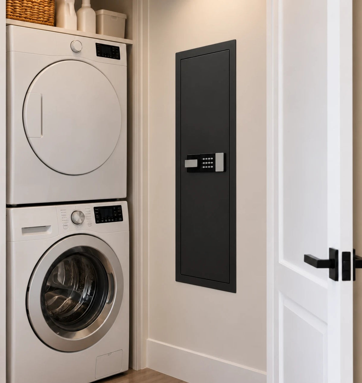 SLATE M in-wall gun safe in black, in a laundry-room wall next to a stacked washer and dryer