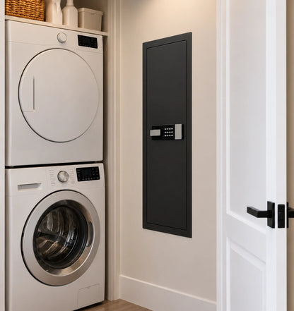 SLATE M in-wall gun safe in black, in a laundry-room wall next to a stacked washer and dryer