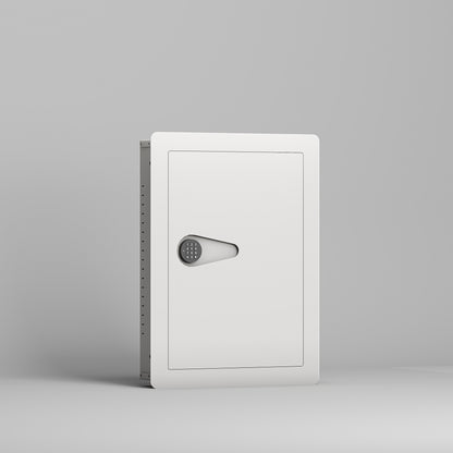 SLATE S in-wall safe in white, closed, front three-quarter view from the left of the small in-wall safe